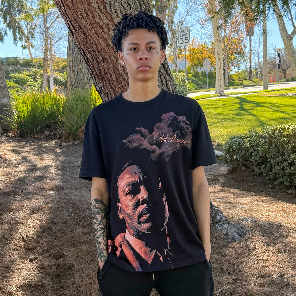 Mason wearing the Still Dreaming tee, front