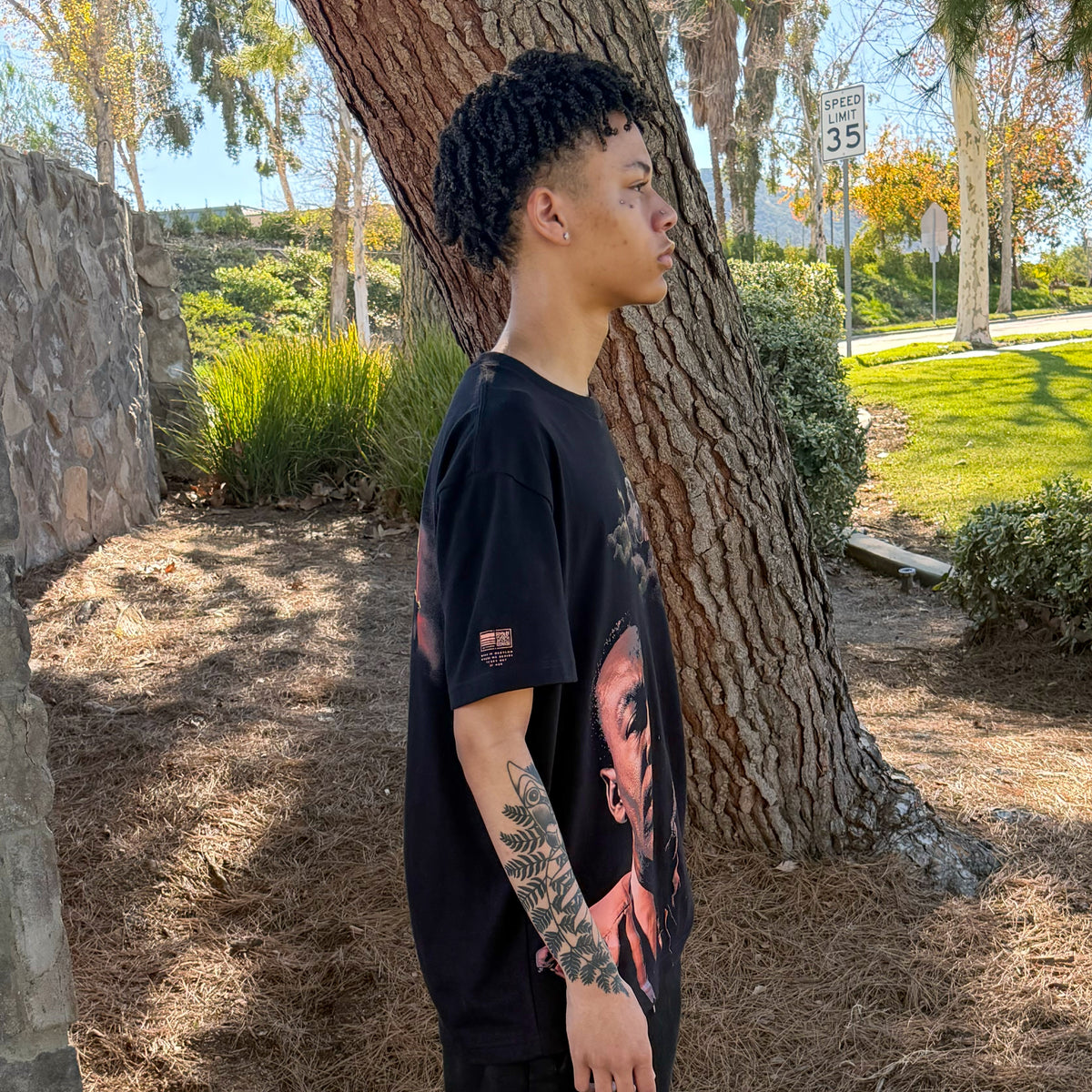 Mason wearing the Still Dreaming tee, side profile