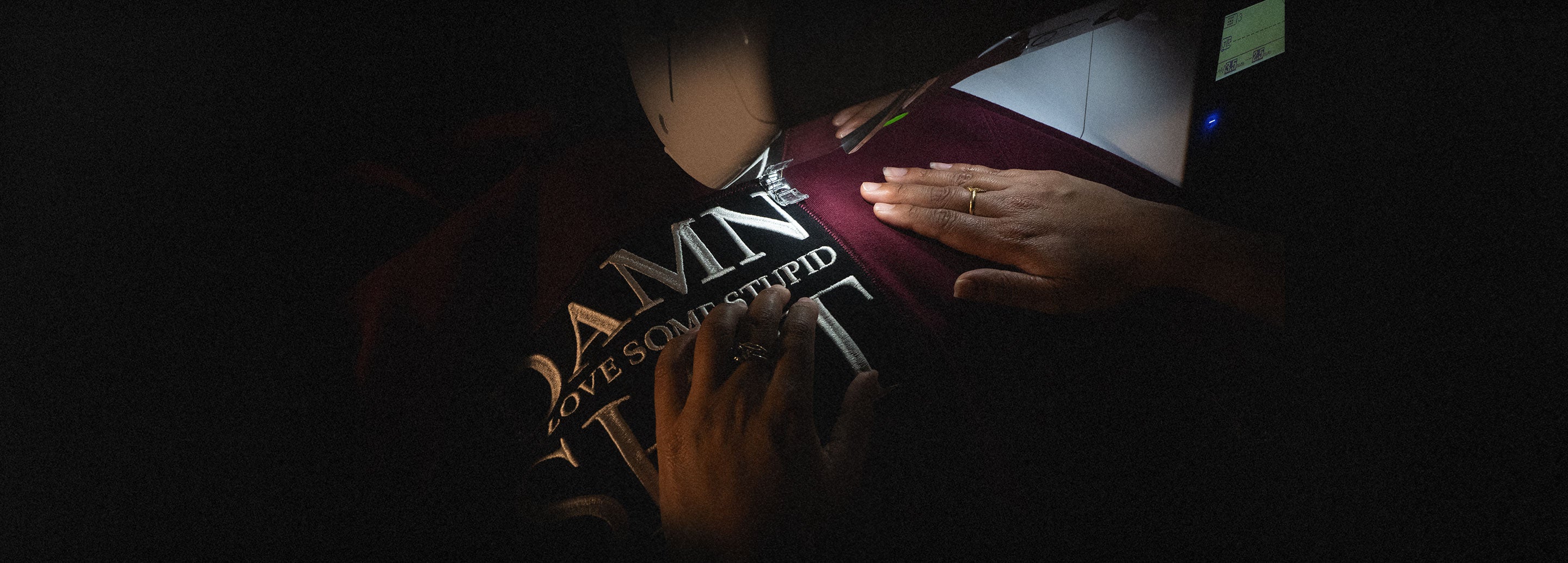 A garment being finished by hand in the BLMTD studio